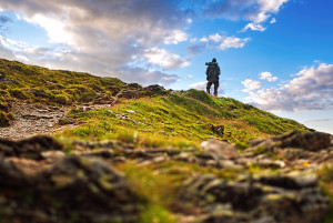 Tourist on rock. Sport and active life concept